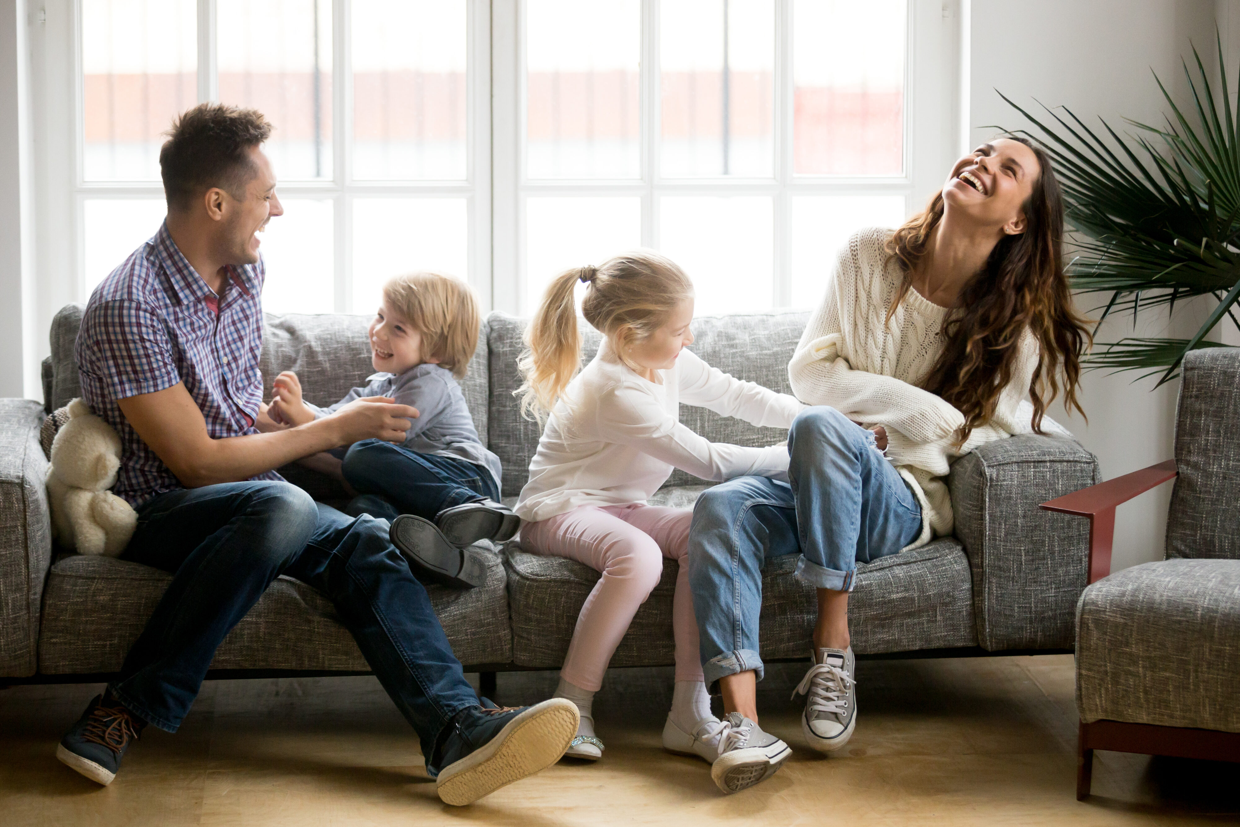 Happy,Parents,And,Kids,Having,Fun,Tickling,Sitting,Together,On Happy,Parents,And,Kids,Having,Fun,Tickling,Sitting,Together,On